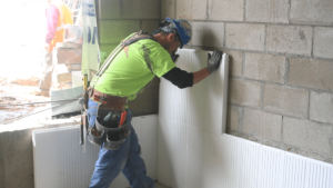 Installing panels at training facility